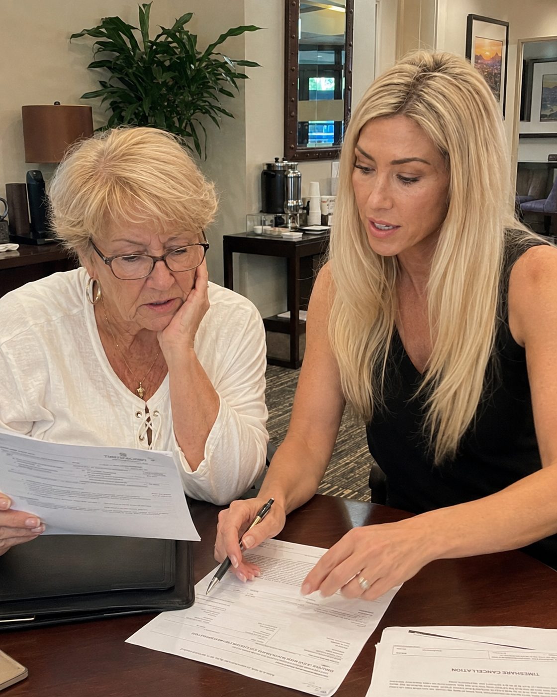 An advisor and an owner reviewing timeshare paperwork together