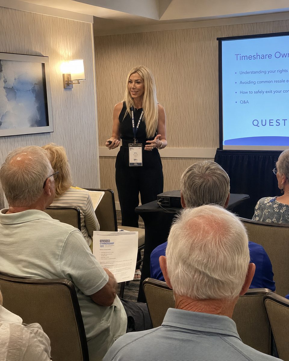 A presenter leading a live timeshare education seminar for owners