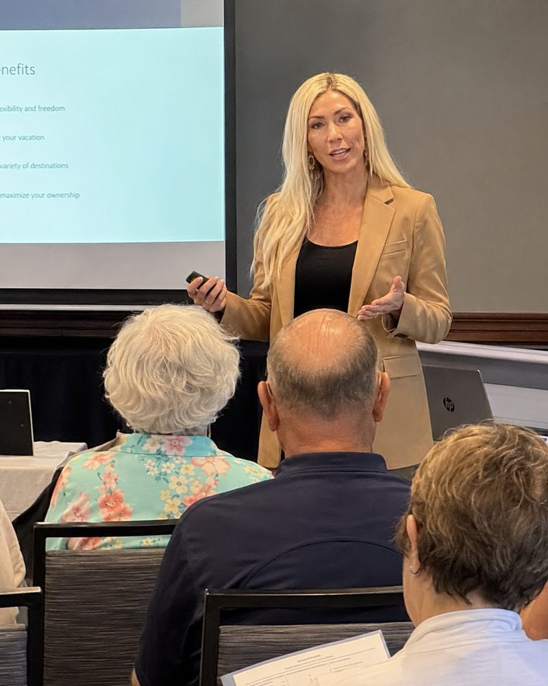A presenter leading a timeshare seminar